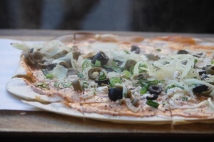 Vegetarian Flamkuchen with olives and cheese